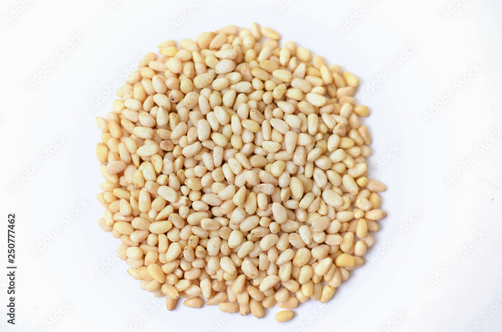 Bunch of Roasted cedar nut on white background Bunch of Roasted cedar nut on white background