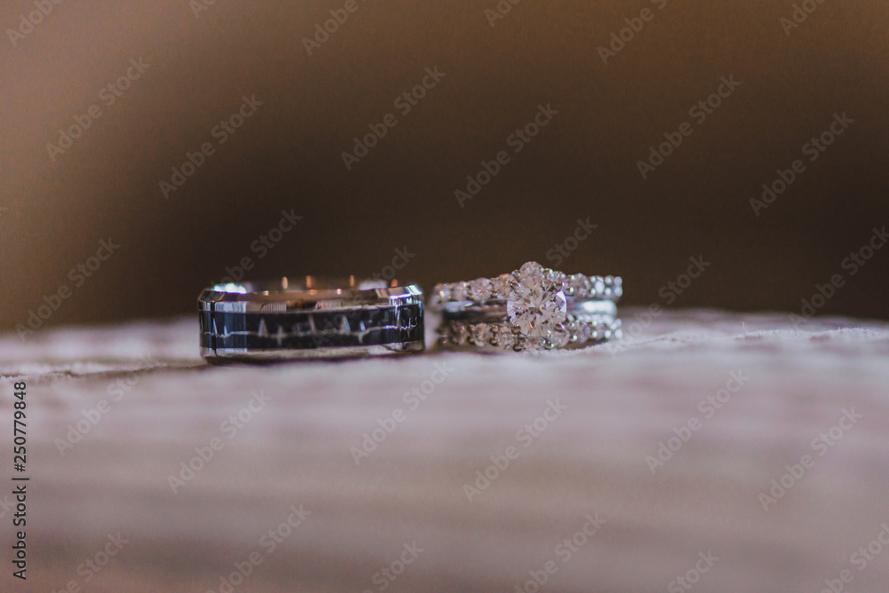 White gold wedding rings with diamonds on white pillow