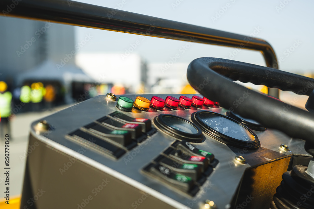 Industrial Vehicle. Heavy Construction Equipment Machine.  asphalt roller, view inside the cabin interior controls
