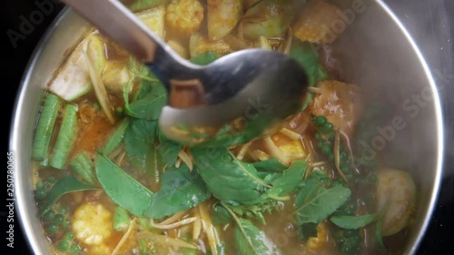 cooking Thai Curry with salmon fish and vegetable