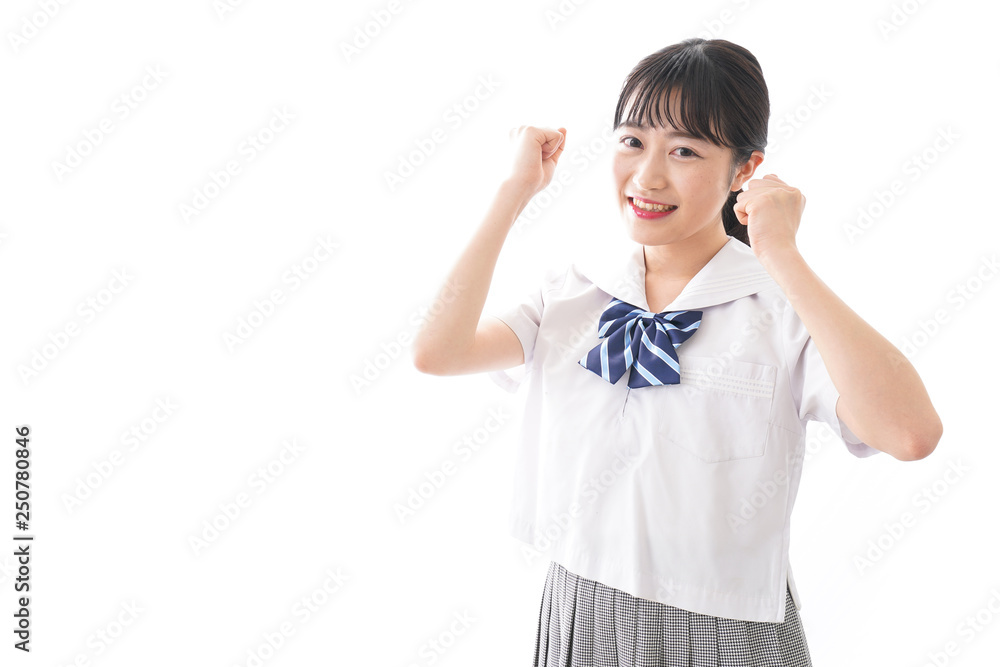 ガッツポーズをする制服姿の学生