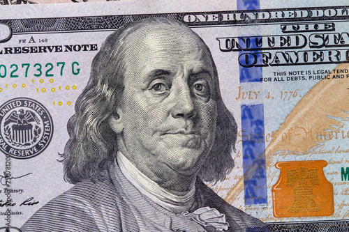 Closeup of a hundred dollar bill. Background of dollar bills. American Dollars Cash Money. Hundred Bucks. Benjamin Franklin's portrait