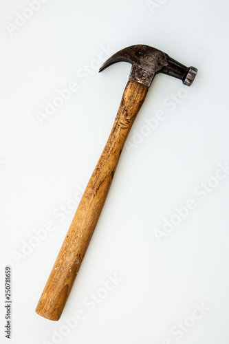 Vintage and old hammer iron head and wood handle put on white background