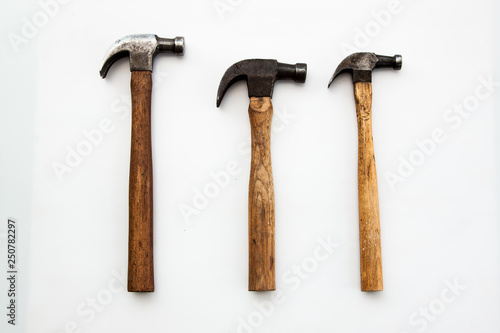 Set of three vintage old hammer on white background, tool for carpenter wood working 