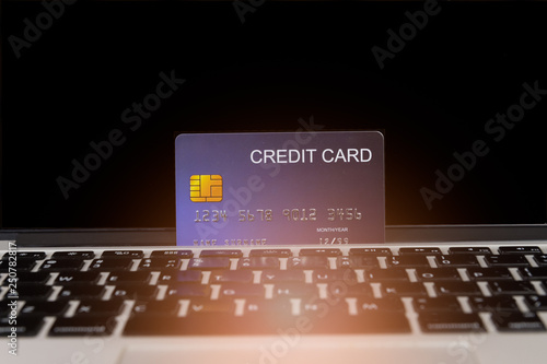credit card place on laptop for preparing to pay with flare