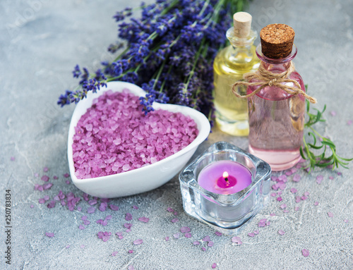 Heart-shaped bowl with sea salt and fresh lavender flowers