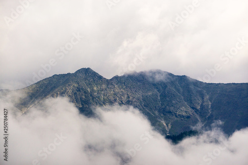 mountain peaks in the clouds