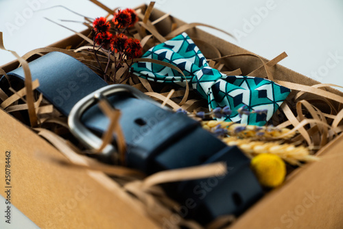 wrapped gift, bow tie and belt, gift for man