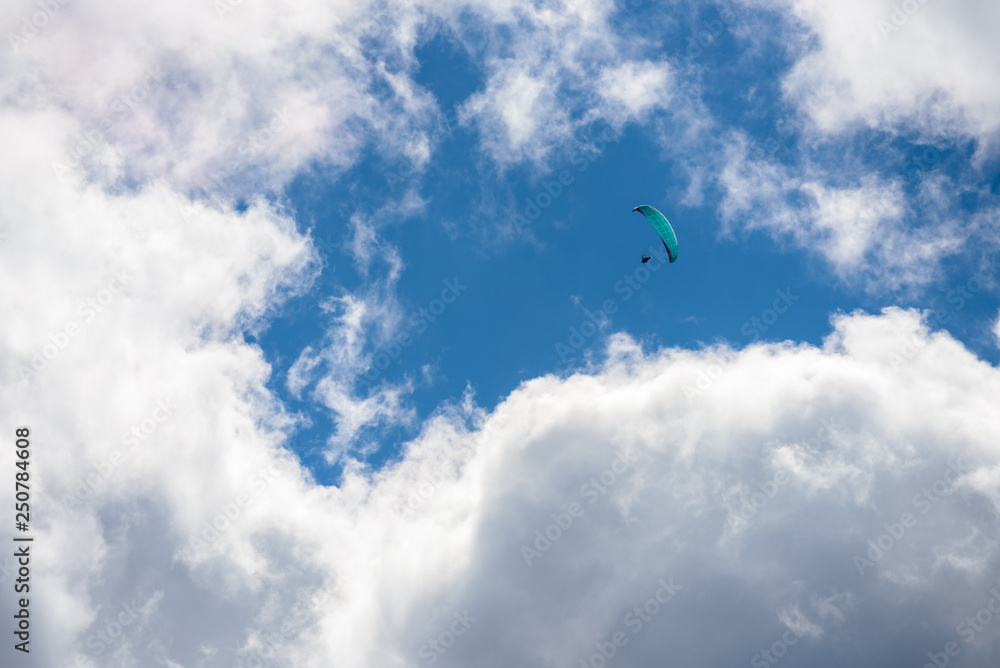parachute action activity ,cloud blue sky at Dolomite Alps, Italy
