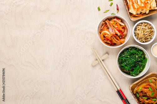 Fotografía Asian korean food and chopsticks on wooden background