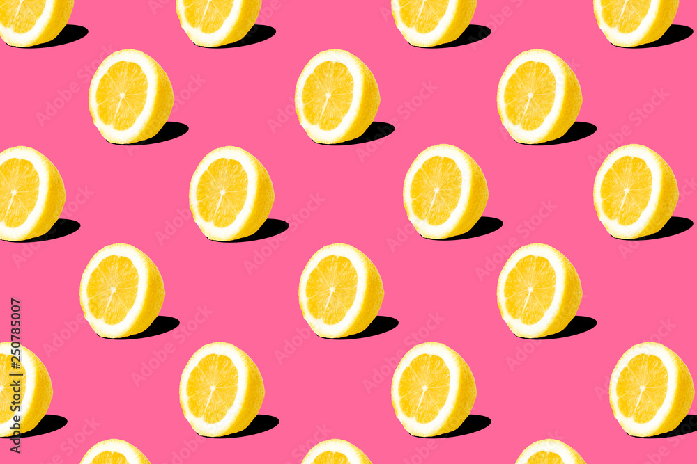 Fresh lemon (lemons) pattern on pink background. Minimal concept. Summer minimal concept. Flat lay Fresh lemon (lemons) pattern on pink background. Minimal concept. Summer minimal concept. Flat lay