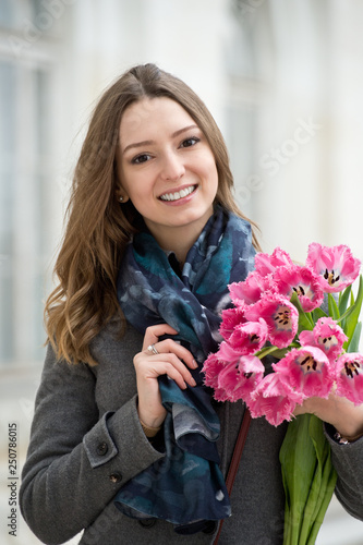 Woman with tulips. Beautiful woman with flowers.