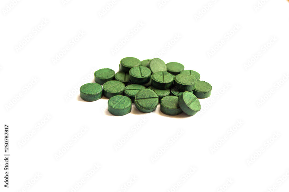 Supplement, spirulina tablets top view. Supplement, spirulina tablets top view.
