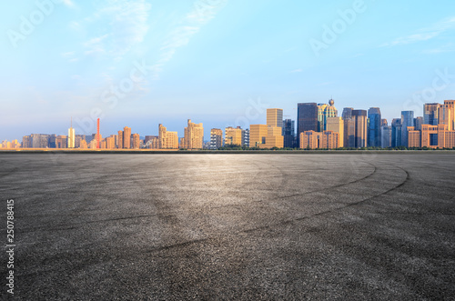 Empty asphalt square ground and Hangzhou business district cityscape