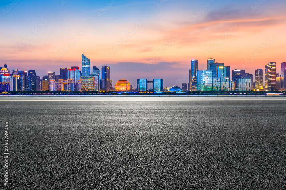 Empty asphalt road through Hangzhou business district Empty asphalt road through Hangzhou business district