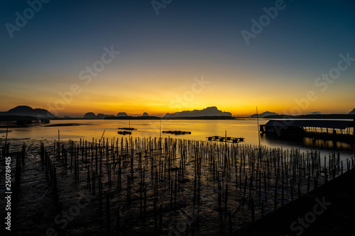 Sunrise at fishing port © Thomrongchai