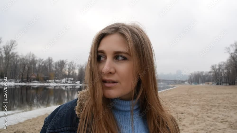 Portrait of a cheerful girl in a denim jacket and Golf on the beach in the city. Portrait of a cheerful girl in a denim jacket and Golf on the beach in the city.