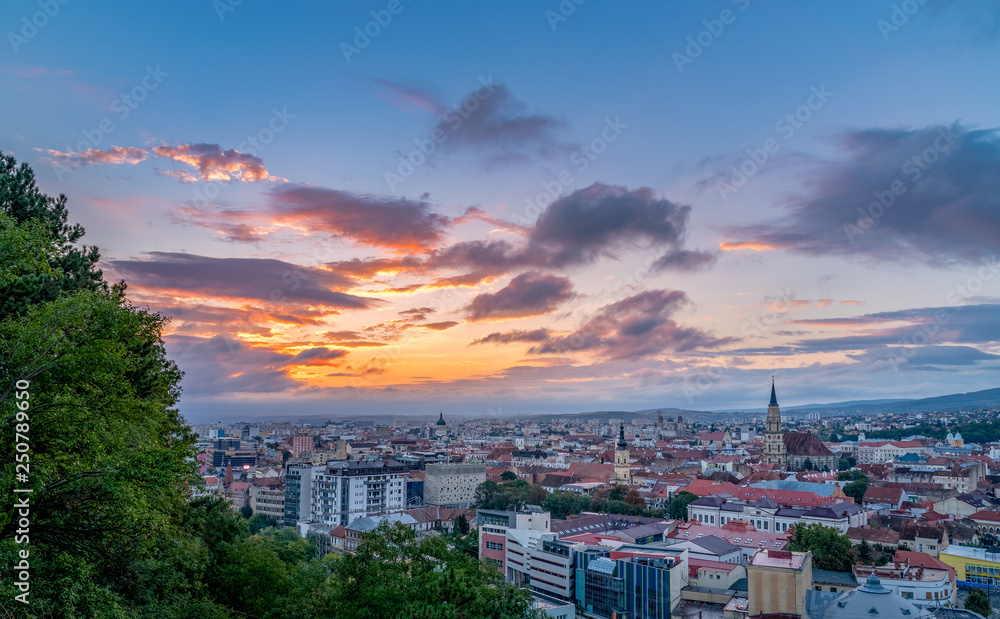Cluj city overview at sunrise from Cetatuia Hill in Cluj-Napoca, Romania