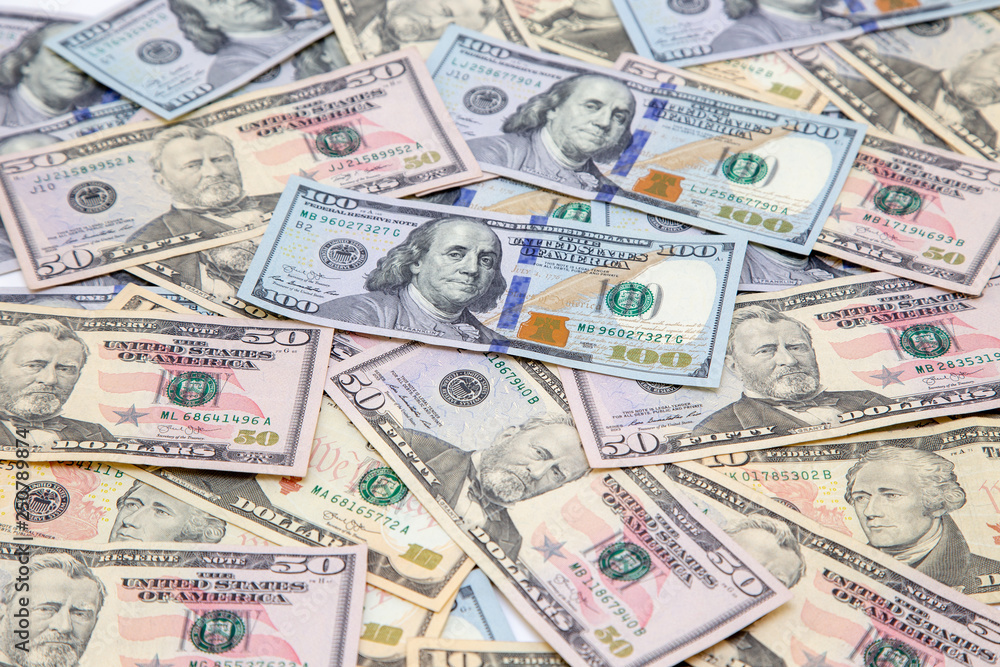 Background of dollar bills. American Dollars Cash Money. One hundred dollars, fifty dollars, ten dollars Banknotes. Hundred Bucks. Background of dollar bills. American Dollars Cash Money. One hundred dollars, fifty dollars, ten dollars Banknotes. Hundred Bucks.