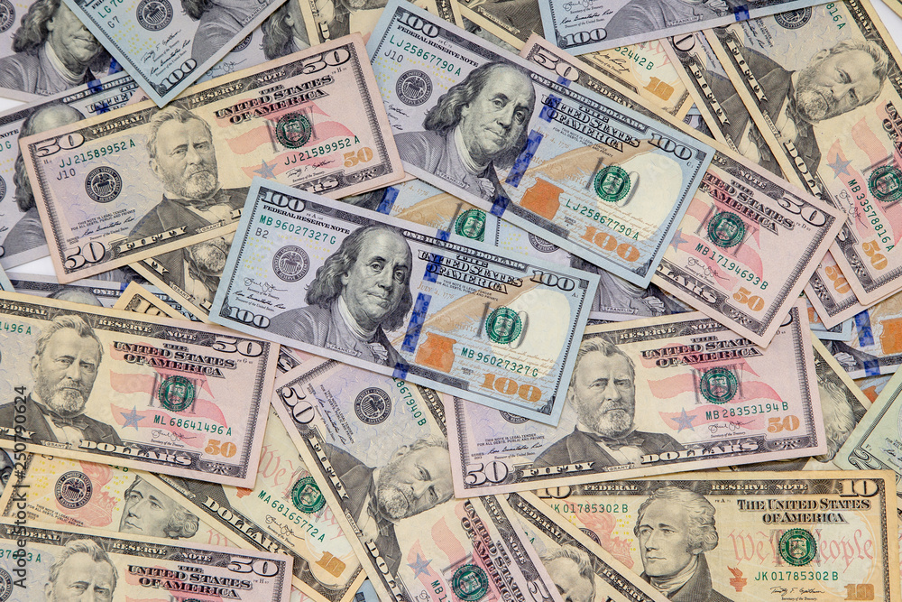 Background of dollar bills. American Dollars Cash Money. One hundred dollars, fifty dollars, ten dollars Banknotes. Hundred Bucks. Background of dollar bills. American Dollars Cash Money. One hundred dollars, fifty dollars, ten dollars Banknotes. Hundred Bucks.