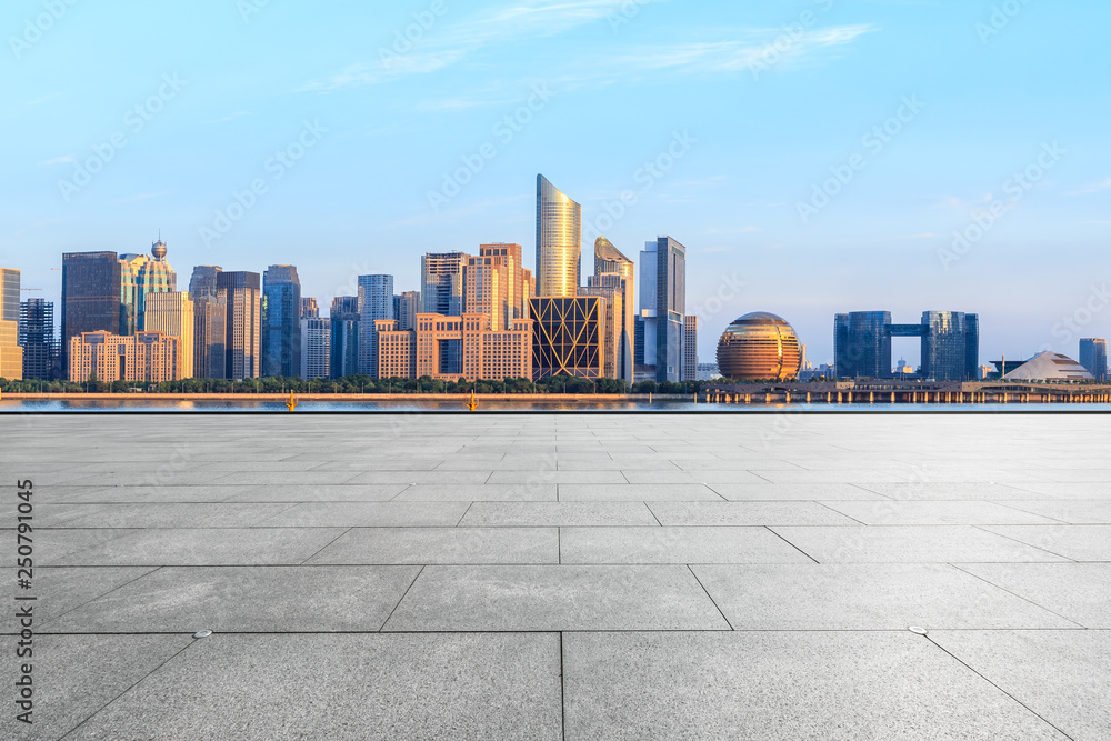 Empty square floor and Hangzhou city skyline with buildings Empty square floor and Hangzhou city skyline with buildings