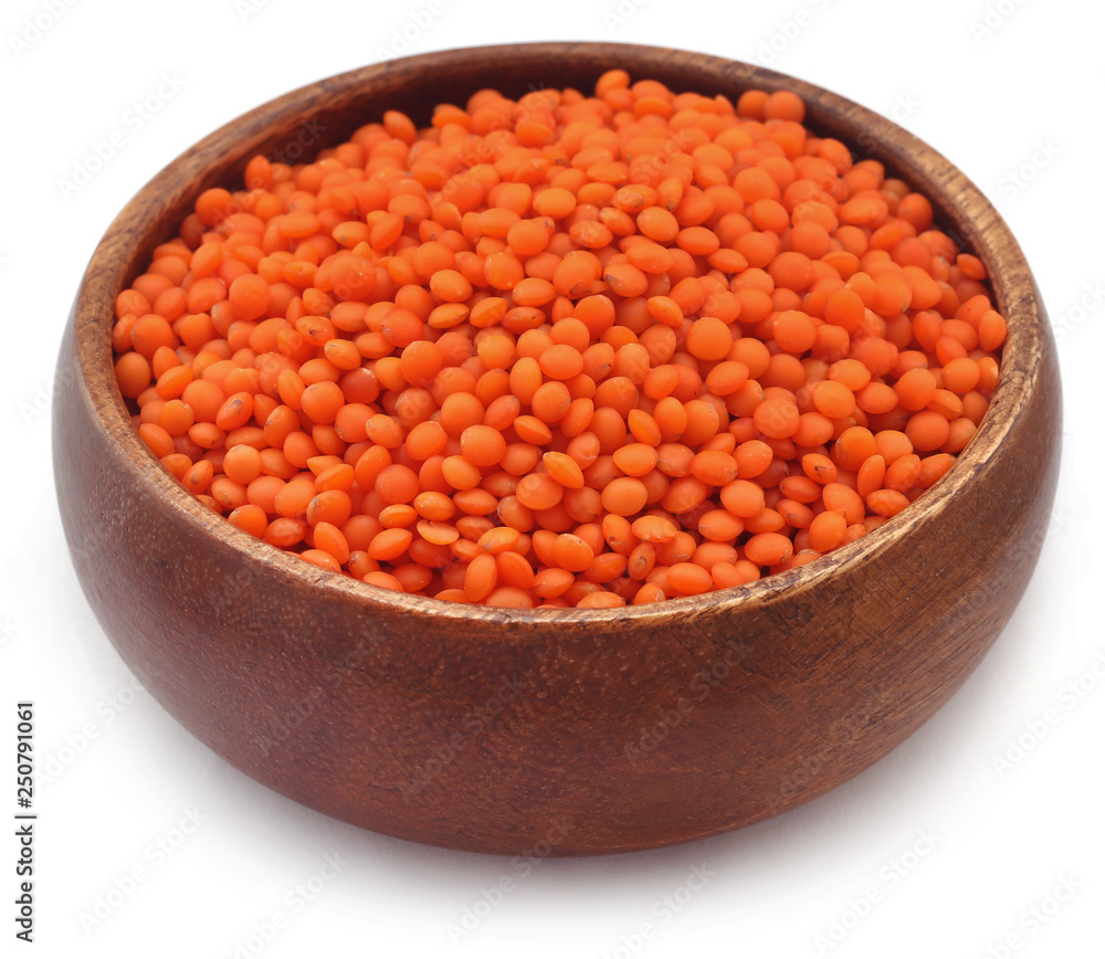Pile of some fresh lentil in wooden bowl Pile of some fresh lentil in wooden bowl