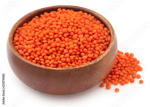 Pile of some fresh lentil in wooden bowl