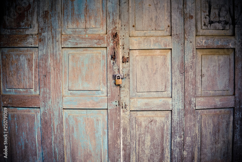 old wooden doors ancient with padlock on door