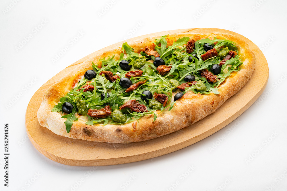 vegan pizza with dried tomatoes, olives and arugula salad vegan pizza with dried tomatoes, olives and arugula salad