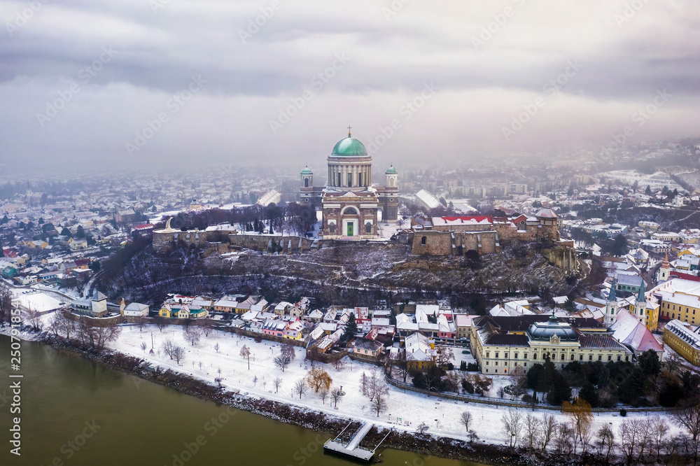 Esztergom, Hungary - Aerial skyline view of Esztergom with the beautiful snowy Basilica on a foggy winter morning