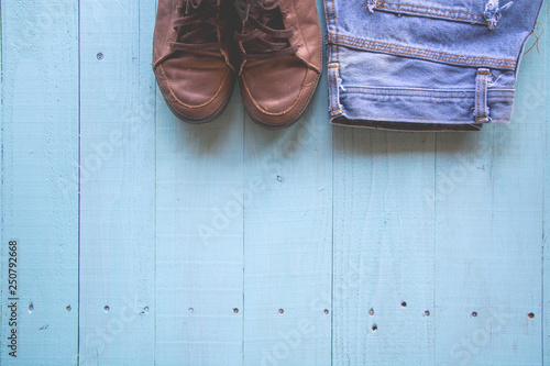 Pastel color,vintage style,Hat,shoes,Jeans on wood background.soft and blur.