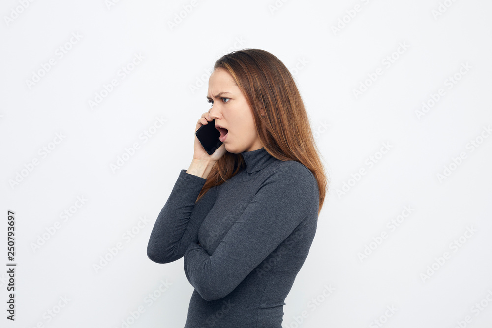 young woman on the phone looking left