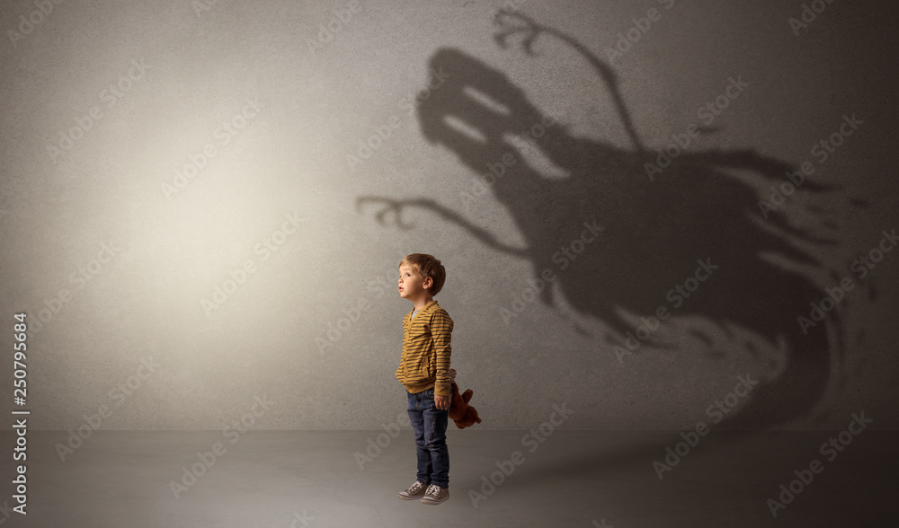 Scary ghost shadow in a dark empty room with a cute blond child
Scary ghost shadow in a dark empty room with a cute blond child