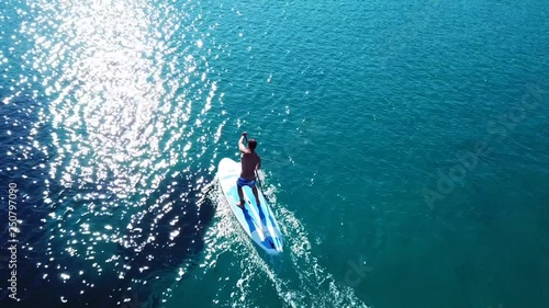 Aerial drone video of competition sport paddle surfing or sup in tropical Caribbean sea photo