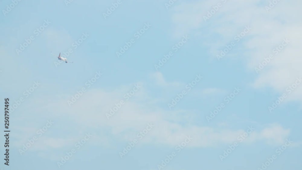 Passenger airplane takes off against the blue sky with clouds Passenger airplane takes off against the blue sky with clouds