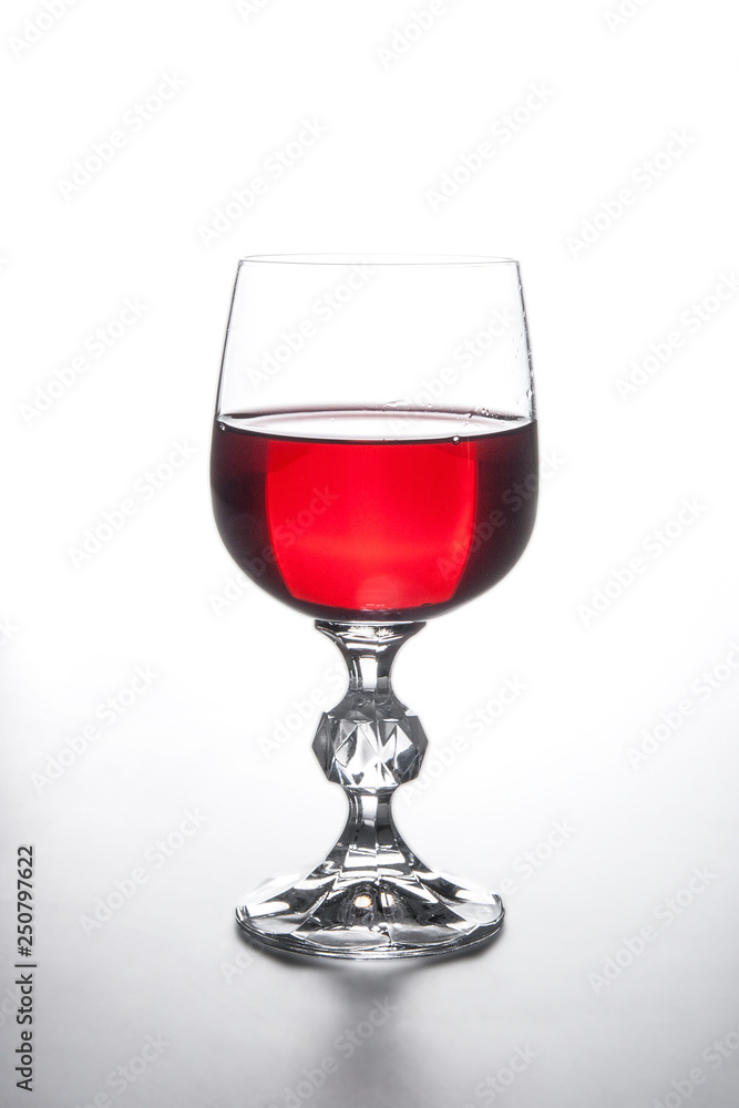 Glass of red wine on light background. Glass of red wine on light background.