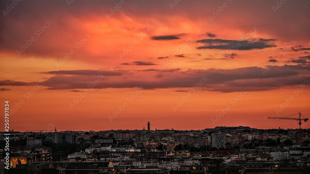 Burning sky over rome skyline in sunset time