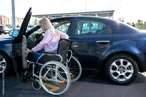 Image of young disabled woman trying to reach her car