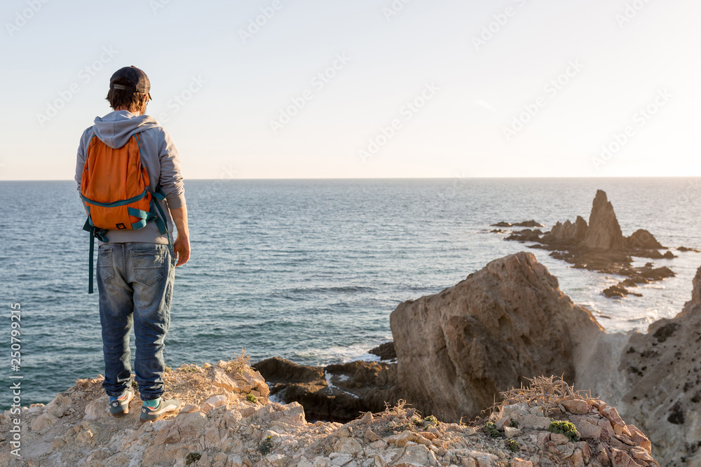 Man exploring Spanish coastline, Cabo de Gata - Nijar Natural Park, Spain