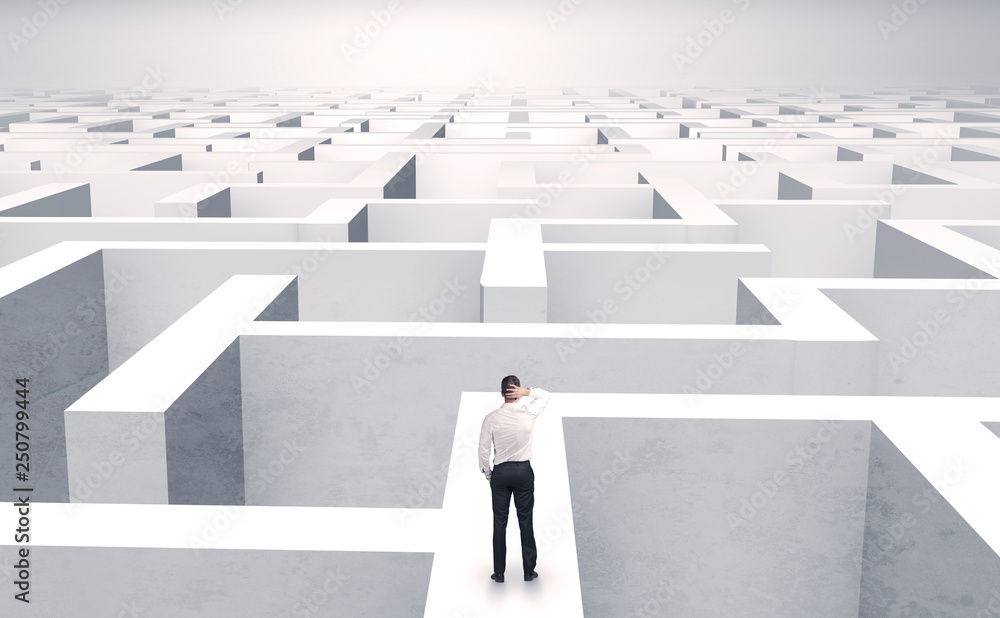 Small businessman in a middle of a huge maze
Small businessman in a middle of a huge maze