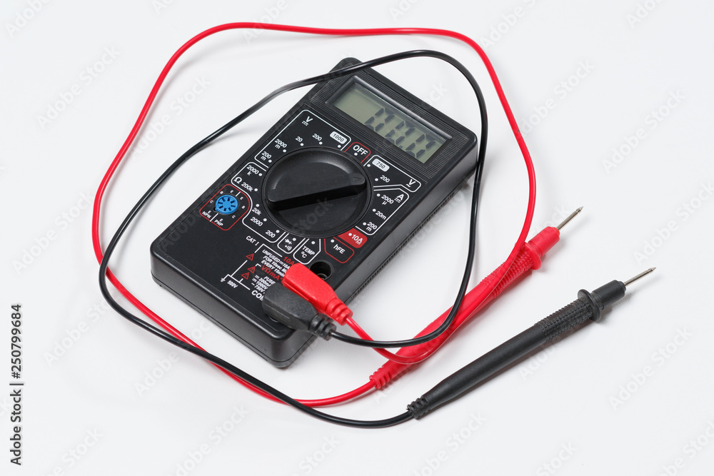 Tool for checking electrical circuits. Digital multimeter on white background Tool for checking electrical circuits. Digital multimeter on white background