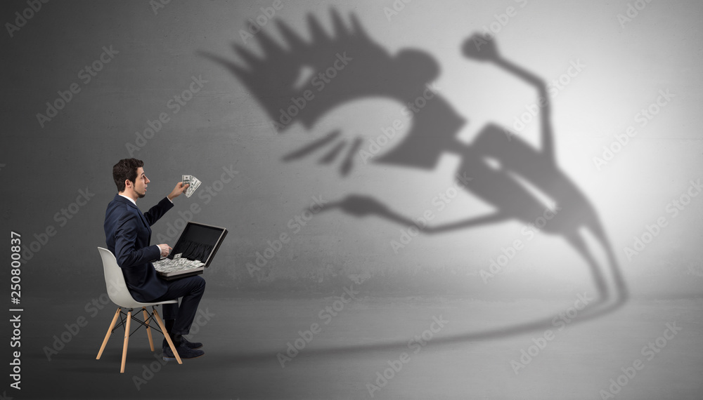 Young businessman staying and negotiate with a monster shadow
Young businessman staying and negotiate with a monster shadow