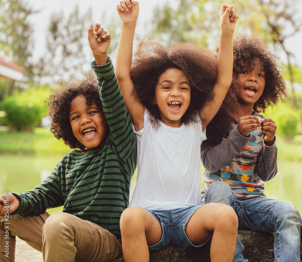 Happy kids group playing in the park in school. Stock Photo | Adobe Stock