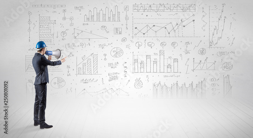 Engineer with construction helmet holding a plan and standing with graphs  charts and reports on the background