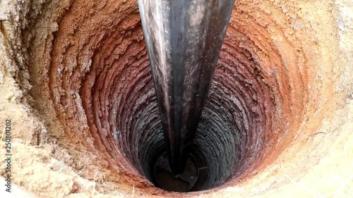 Water Well Drilling, holes boring in ground with drilling rig machine