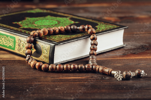 islamic holy book on wooden table