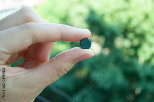 Supplement, spirulina tablets top view.