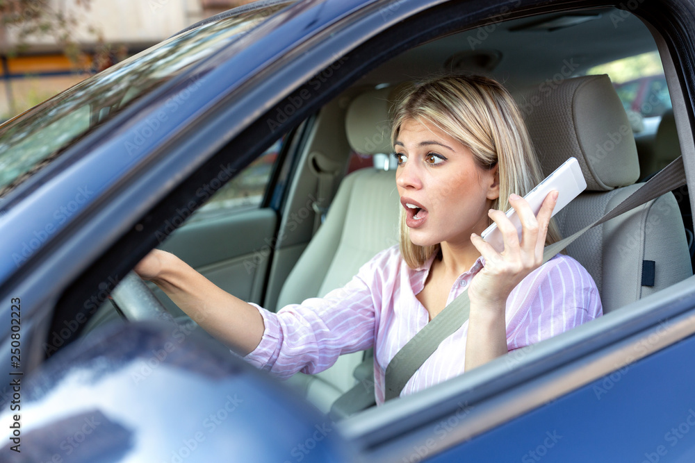 Young woman in shock during driving