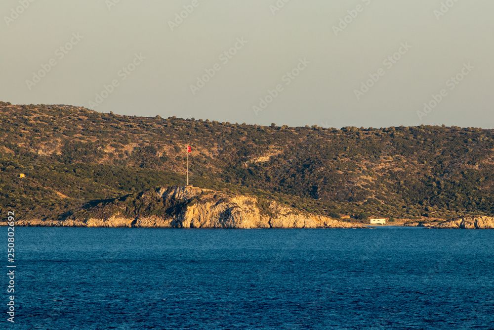 Turkish land and flag view from Samos island Turkish land and flag view from Samos island