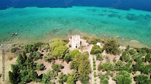 Aerial drone bird's eye view photo of Agia Triada island with beautiful turquoise and sapphire clear water beach, Central Evia, Greece photo